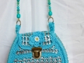 Pop top purse with beaded handle