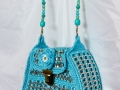 Pop top purse with beaded handle